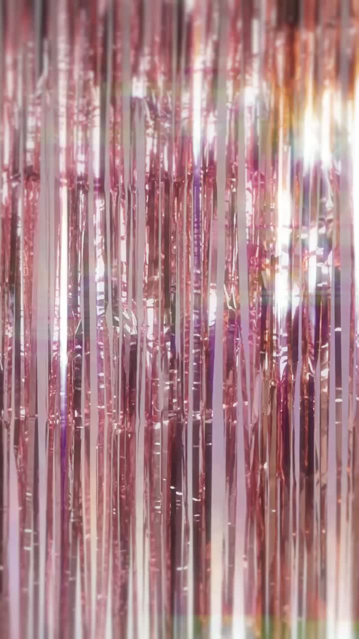 Rose Gold Tinsel Curtain Shimmering with Light Reflections