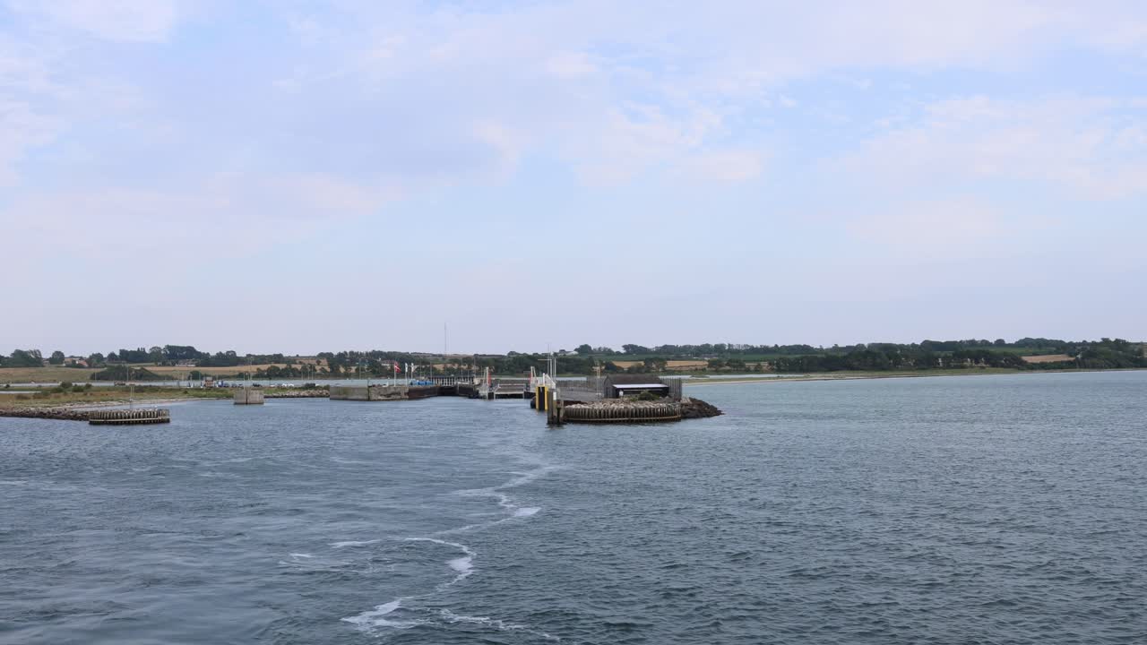 Leaving the coastline in Denmark, boad passing the coast
