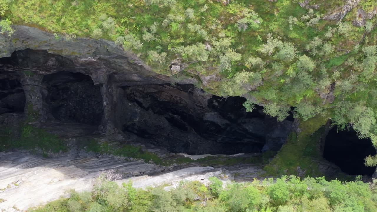 Aerial video of an abandoned lime mine in Norway, with geological rock formations and traces of industrial history