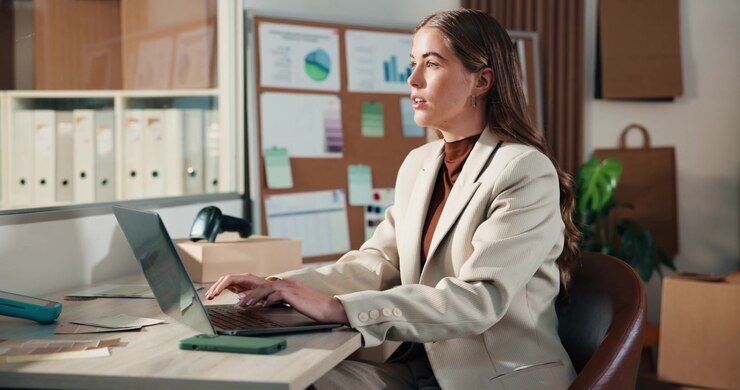 Professional Woman Working on Laptop in Office