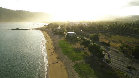Small-town-and-sandy-beach-in-central-Kuta,-Lombok,-aerial-view