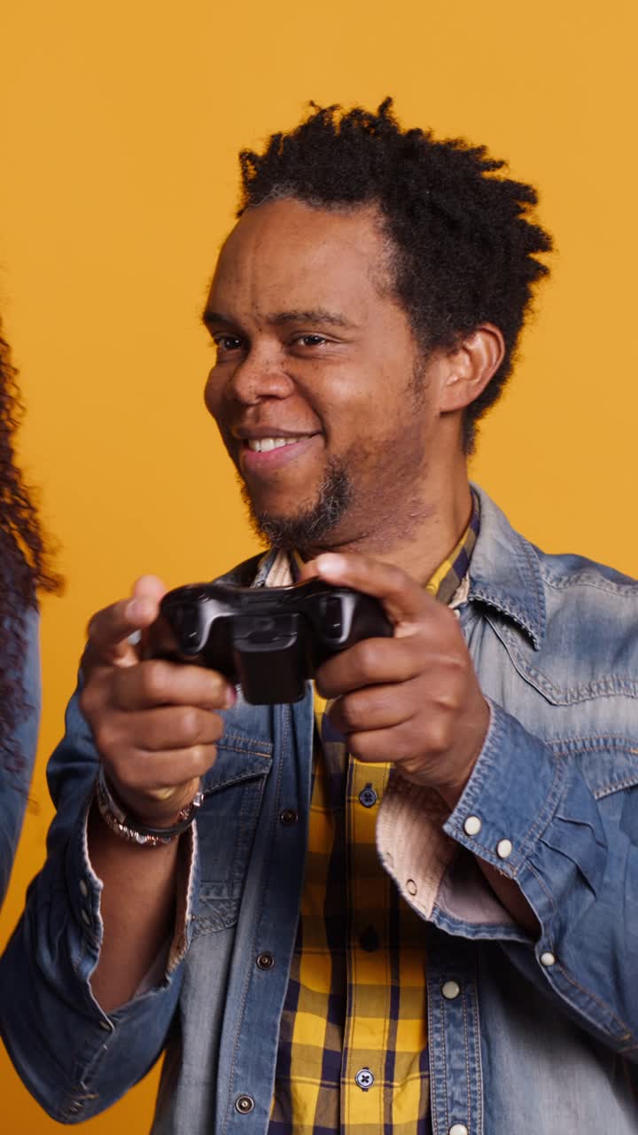 African American Man Playing Video Games with Controller