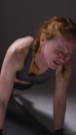 Vertical-Video-Close-Up-Vertical-Video-Studio-Shot-Of-Two-Mature-Women-Wearing-Gym-Fitness-Clothing-Doing-Plank-Exercise-Together