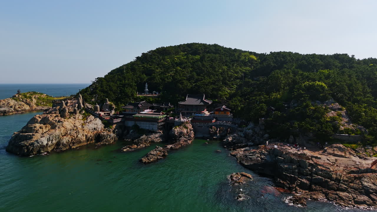 Drone orbiting the Haedong Yonggungsa Temple, summer day in Busan, South Korea