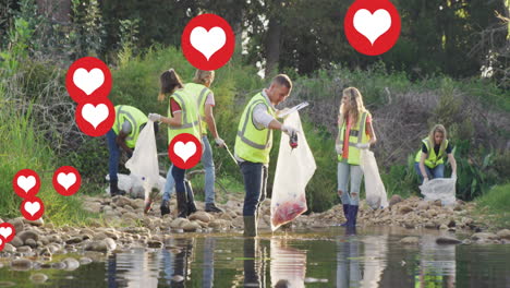 animación de corazones rojos sobre diversos grupos recogiendo basura por el río en el campo