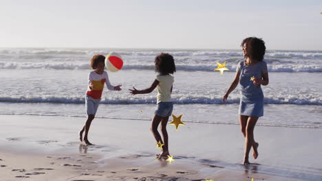 family playing with beach ball on shore with star animation overlay