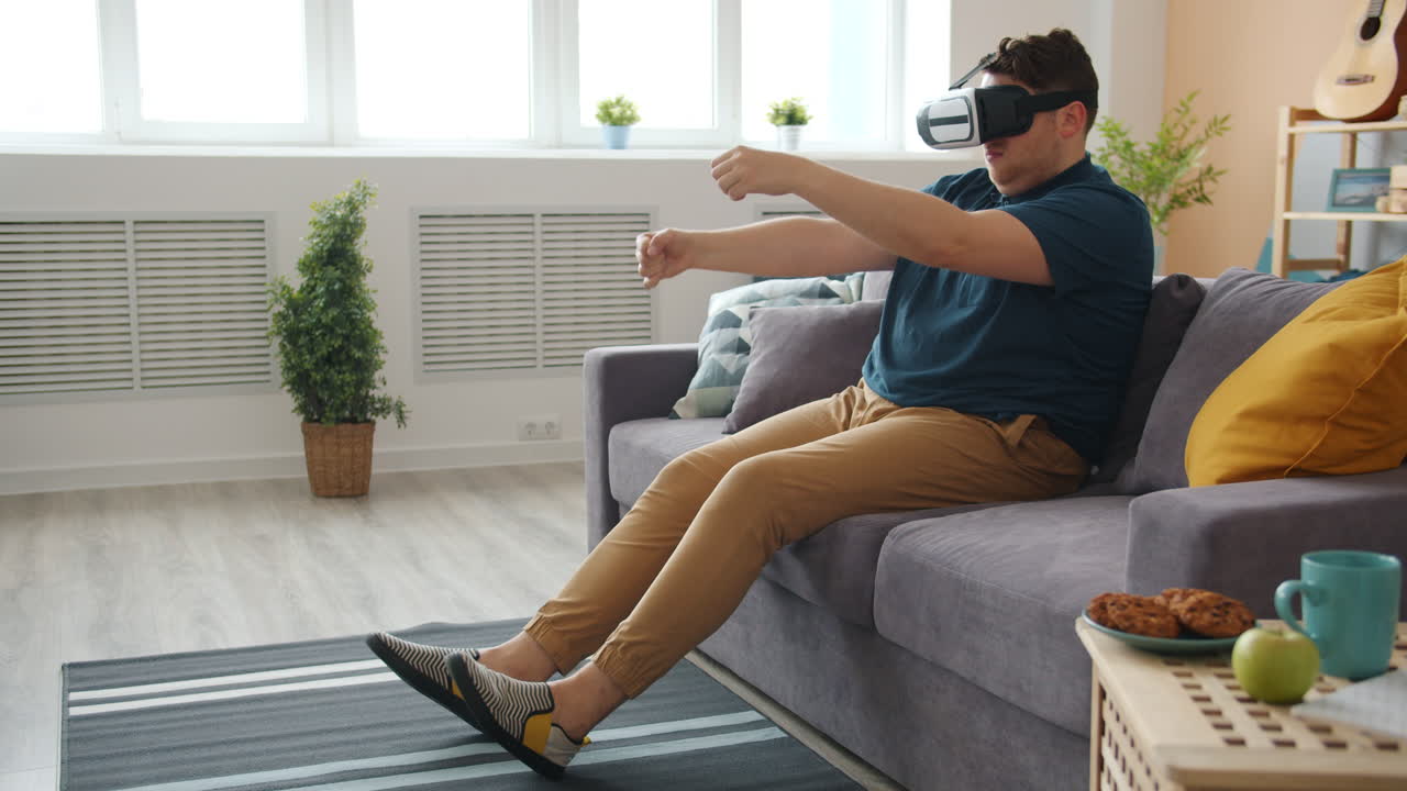 Man Experiencing Virtual Reality on Couch