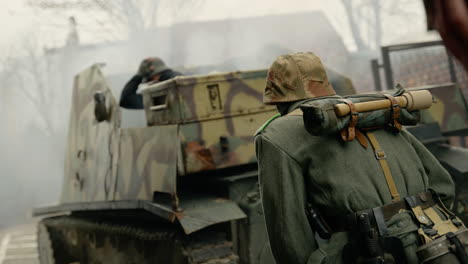 wwii german soldier near tank