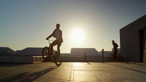 bmx riders on a rooftop