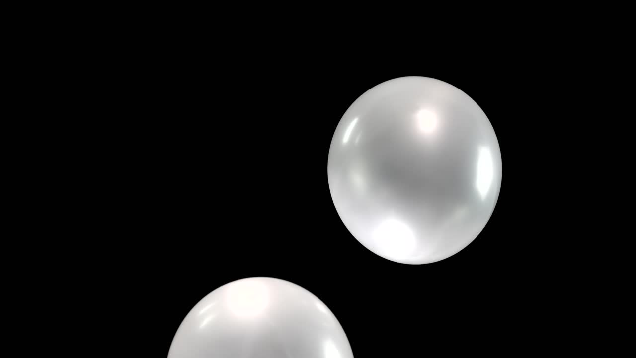 Watch as four gleaming silver balloons gracefully float downward, their reflective surfaces shimmering. The scene is enhanced by seamless background removal, creating a mesmerizing visual display.