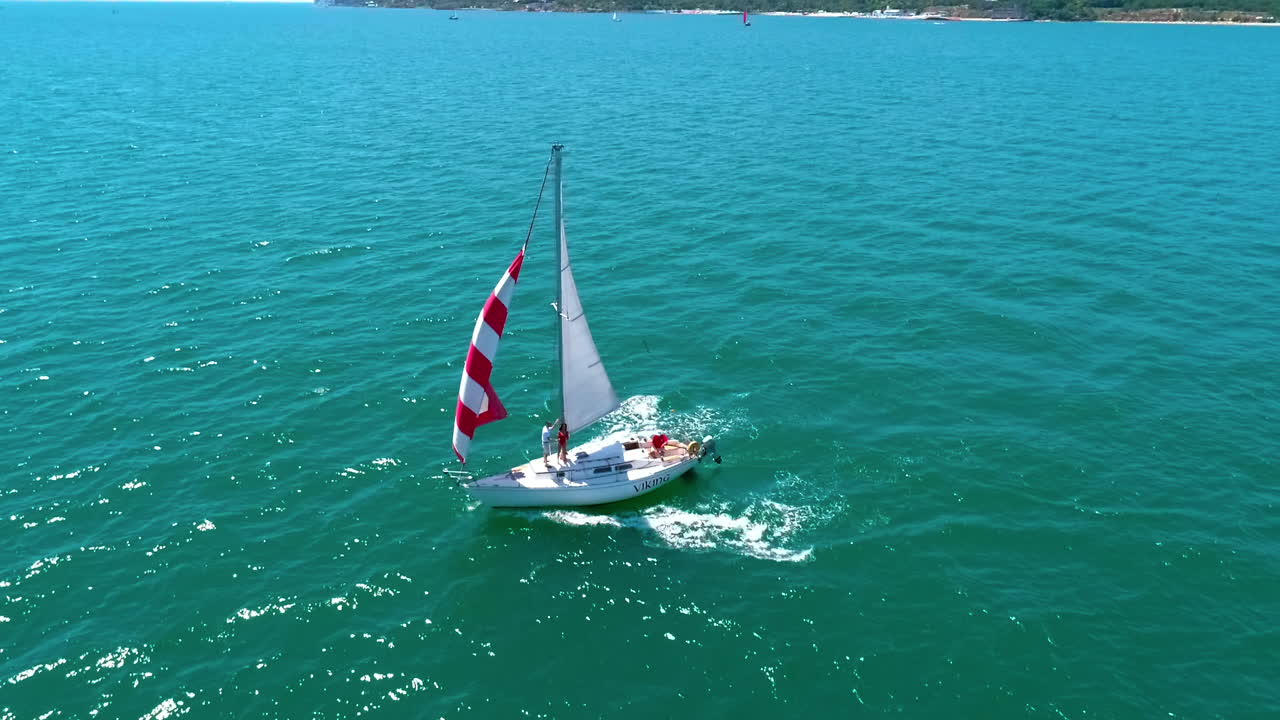 Sailing yacht in wind waves. Seascape with white sails yacht in open sea