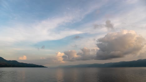 serene lake landscape with mountains and clouds