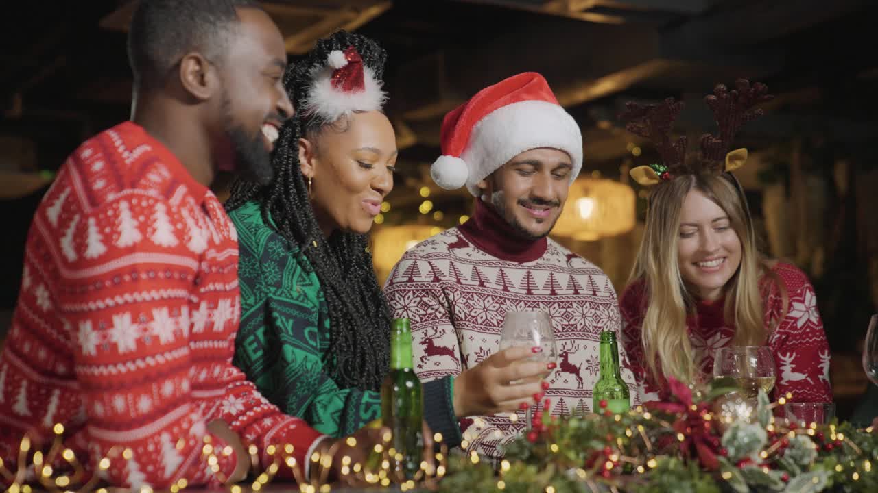Low Angle Shot of a Group of Friends Celebrating Christmas at Bar