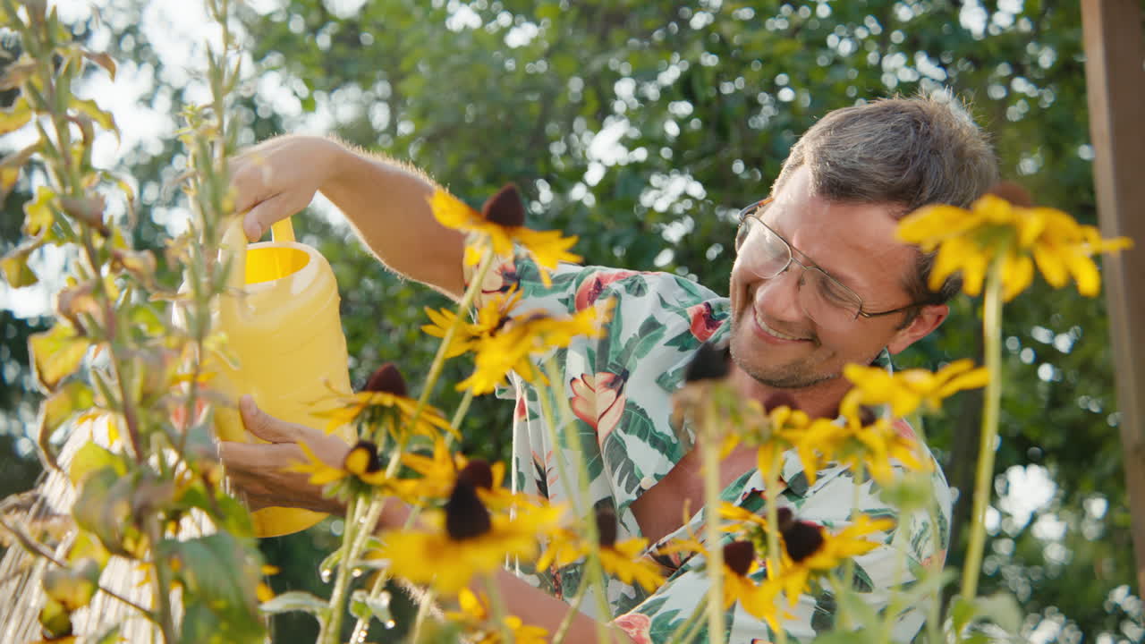 Man Watering Garden Flowers