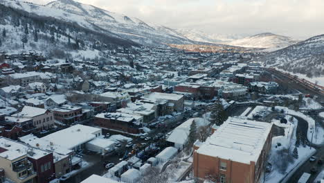 Aerial-Drone-Parallax-of-Park-City,-Utah-in-the-winter-during-the-Sundance-Film-Festival