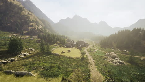 mountain village in a lush valley with surrounding peaks during daytime