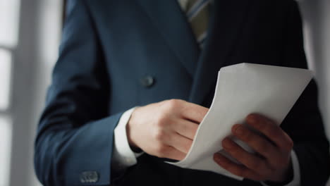 man receiving bribe envelope close up. male hands taking money hundreds euro.