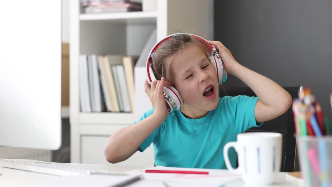 Young Girl with Headphones Expresses Various Emotions While Listening to Music