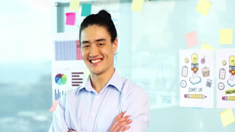 Business-executive-standing-with-arms-crossed-in-office