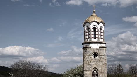 clouds pass over st john baptist eastern orthodox church tower with moon rising