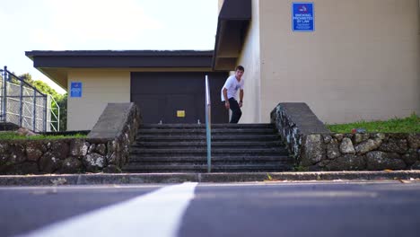 skateboard trick on a hand rail in hawaii