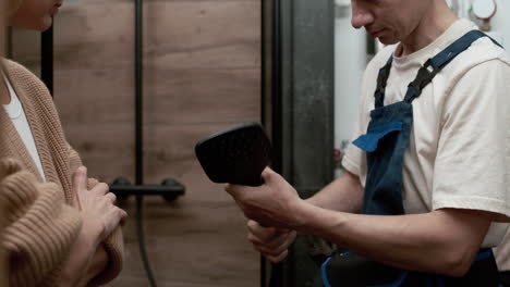 plumber fixing shower head