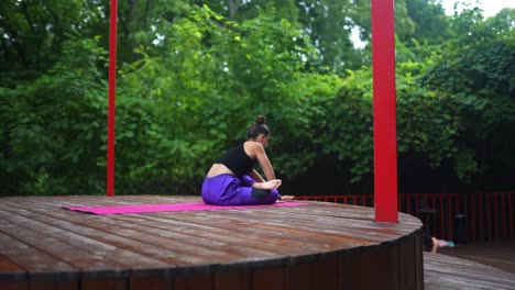 woman practicing yoga outdoors
