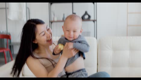 mother and baby playing at home