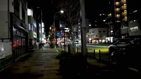 evening traffic and pedestrians on urban road