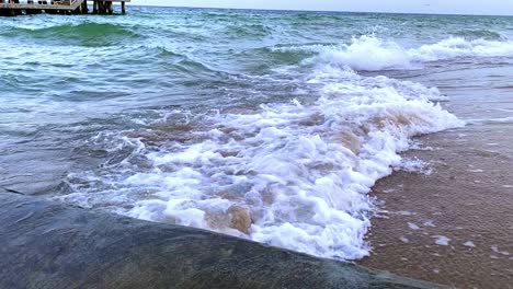 high waves by the sea, storm in the baltic sea. slow motion clear water waves