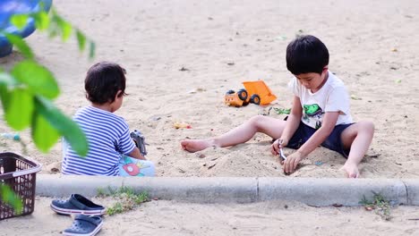 two boys engage in playful activities outdoors