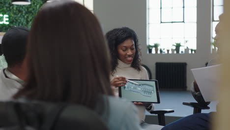 african-american-business-people-brainstorming-engineers-designing-prototype-engine-turbine-using-tablet-computer-3d-technology-creative-team-collaborating-teamwork-sharing-ideas-in-office-meeting