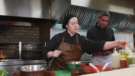 caucasian man and woman cooking