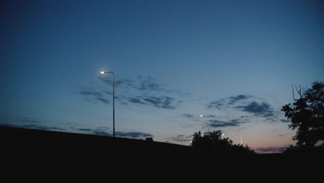 shot of a sunset with car passing in front