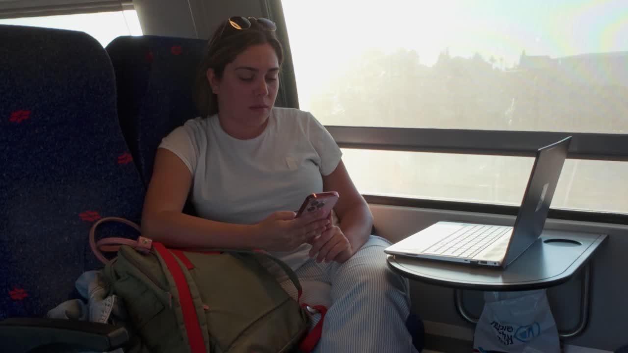 Young Woman Holding a Pink Phone and Scrolling Through Content