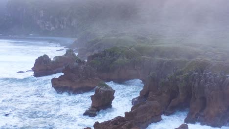 aerial around the pancake rocks geological formations on the coast of south island of new zealand 1