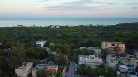 Coastal-town-where-city-meets-nature-and-the-sea-picturesque-streets,-vibrant-city,-lush-greenery-and-clear-waters,-Playa-del-Carmen,-Mexico