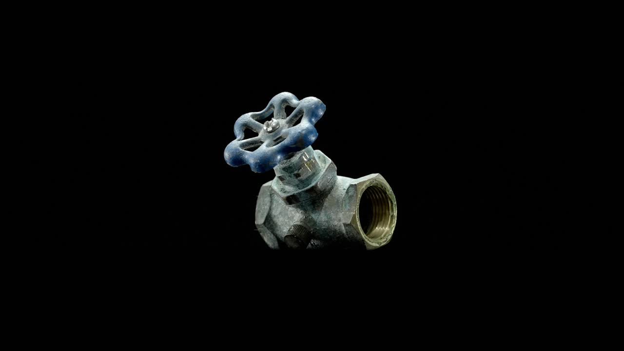 Main water line failed valve on black background close up shot