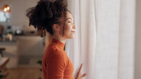 woman looking out window