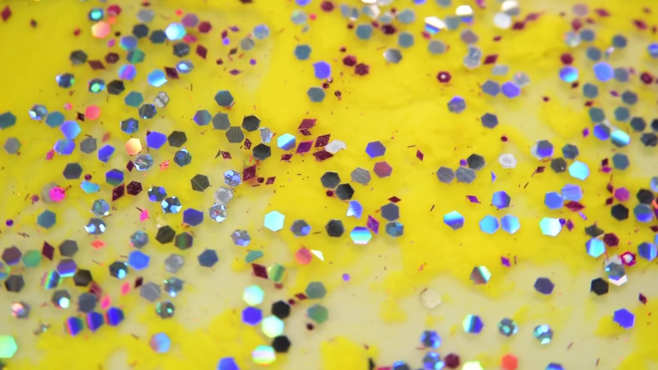 Texture gialla con glitter colorati