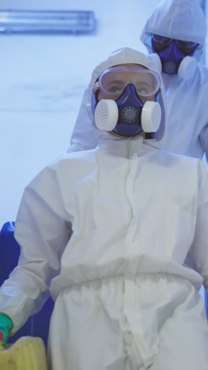 People in Hazmat Suits