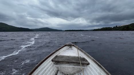 front of boat view, rough lake crossing under dramatic cloudy sky