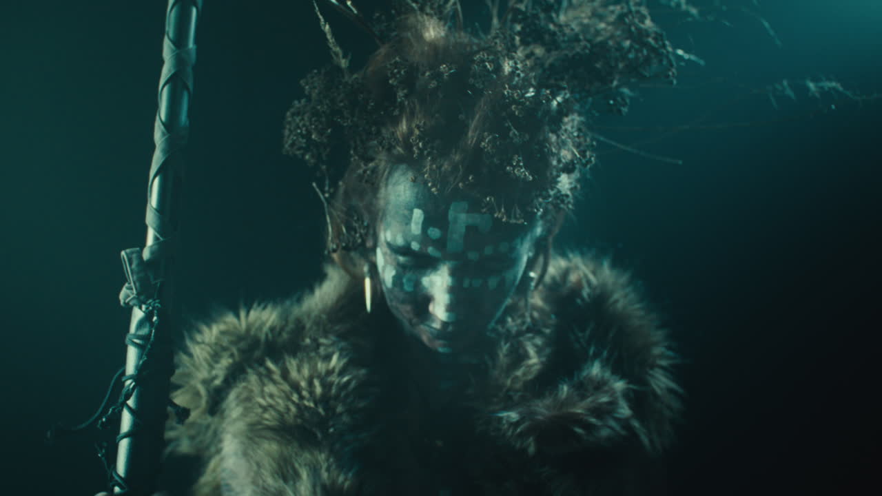 A creepy witch rises her head during the night storm