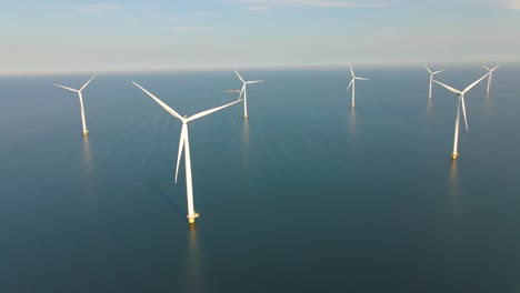 huge windmill turbines, offshore windmill farm in the ocean westermeerwind park , windmills isolated at sea on a beautiful bright day netherlands flevoland noordoostpolder