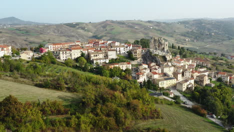 aerial orbiting shot of a hilltop old town pietracupa in molise region in italy