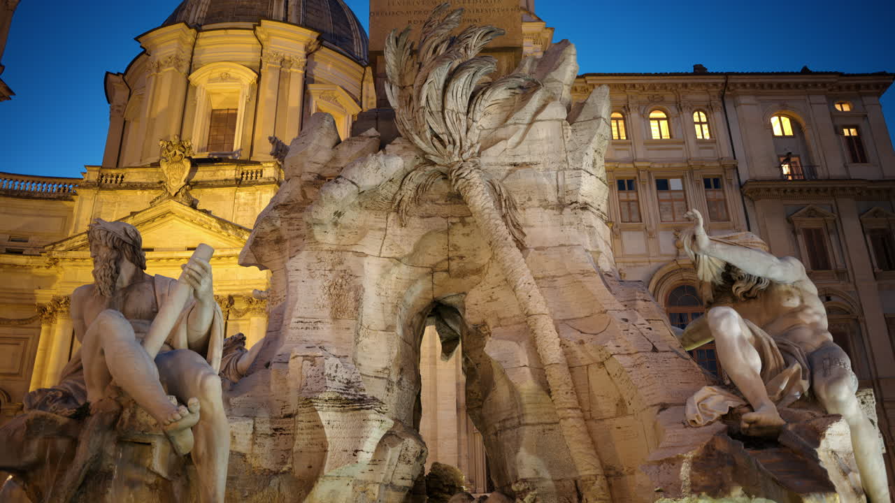 Fountain of the Four Rivers located in Navona square. Rome city square at sunset. Italy