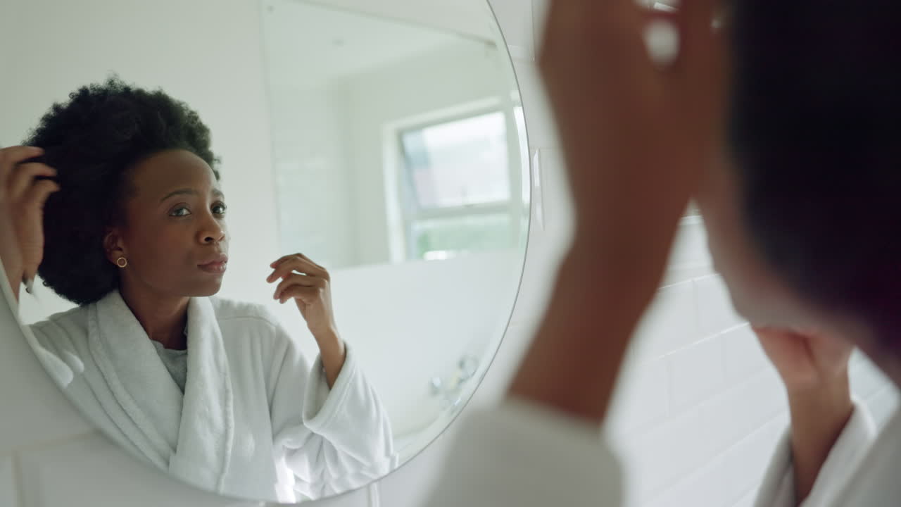 Morning hair care and black woman in bathroom