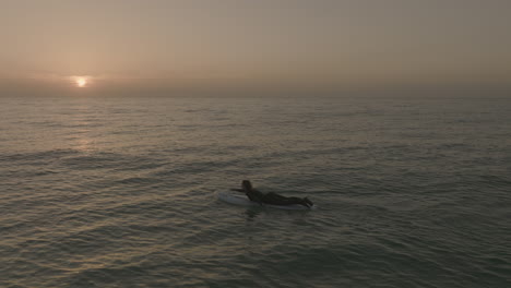 apple-prores-422-surfer-girl-paddling-into-sunrise-fuerteventura-Canary-Islands