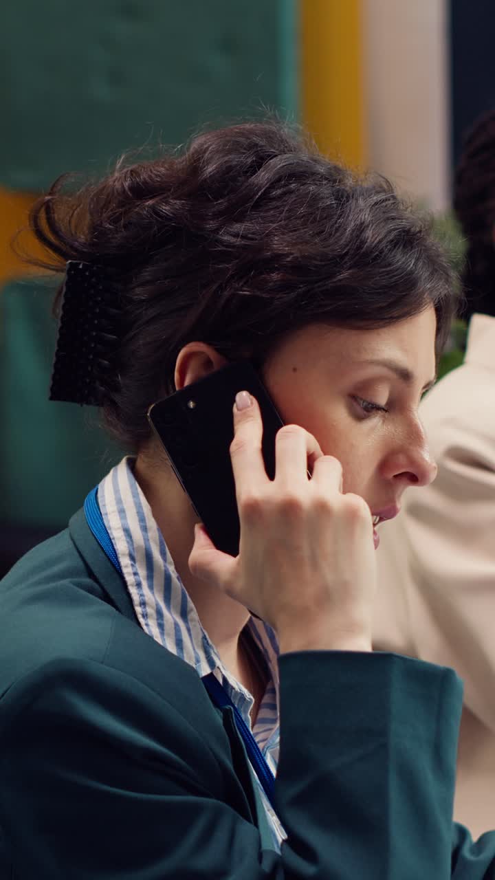Professional Woman Talking on Smartphone in Office