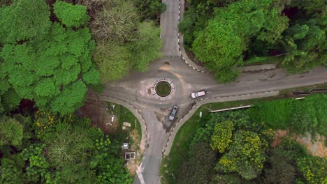 Mahe-Seychelles-small-round-about-in-urban-location,-few-passing-vehicles